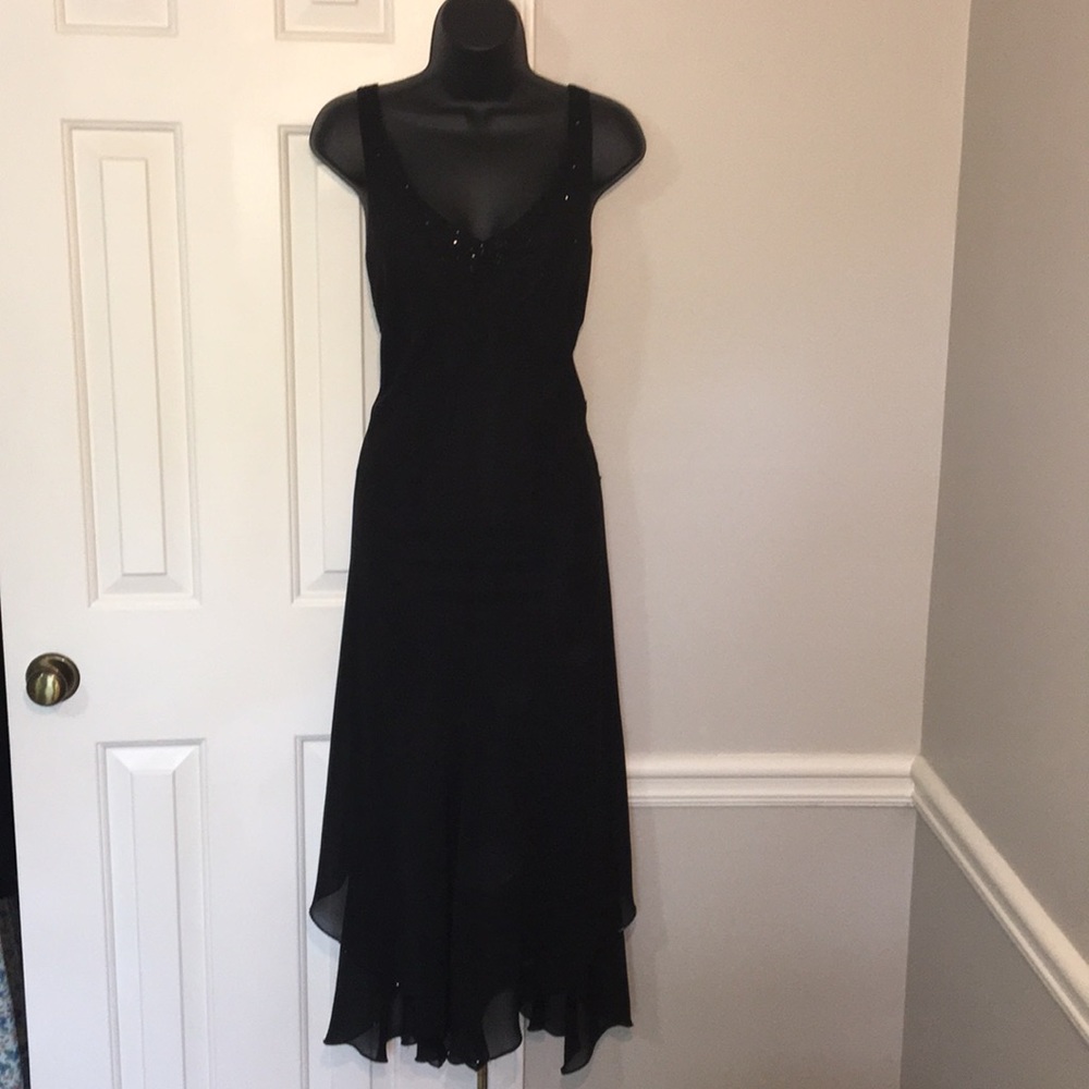 Classic lined black cocktail dress.